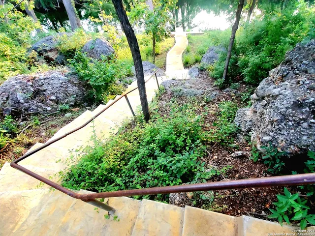a view of a garden from a balcony