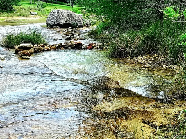 a backyard of a house with yard and outdoor seating
