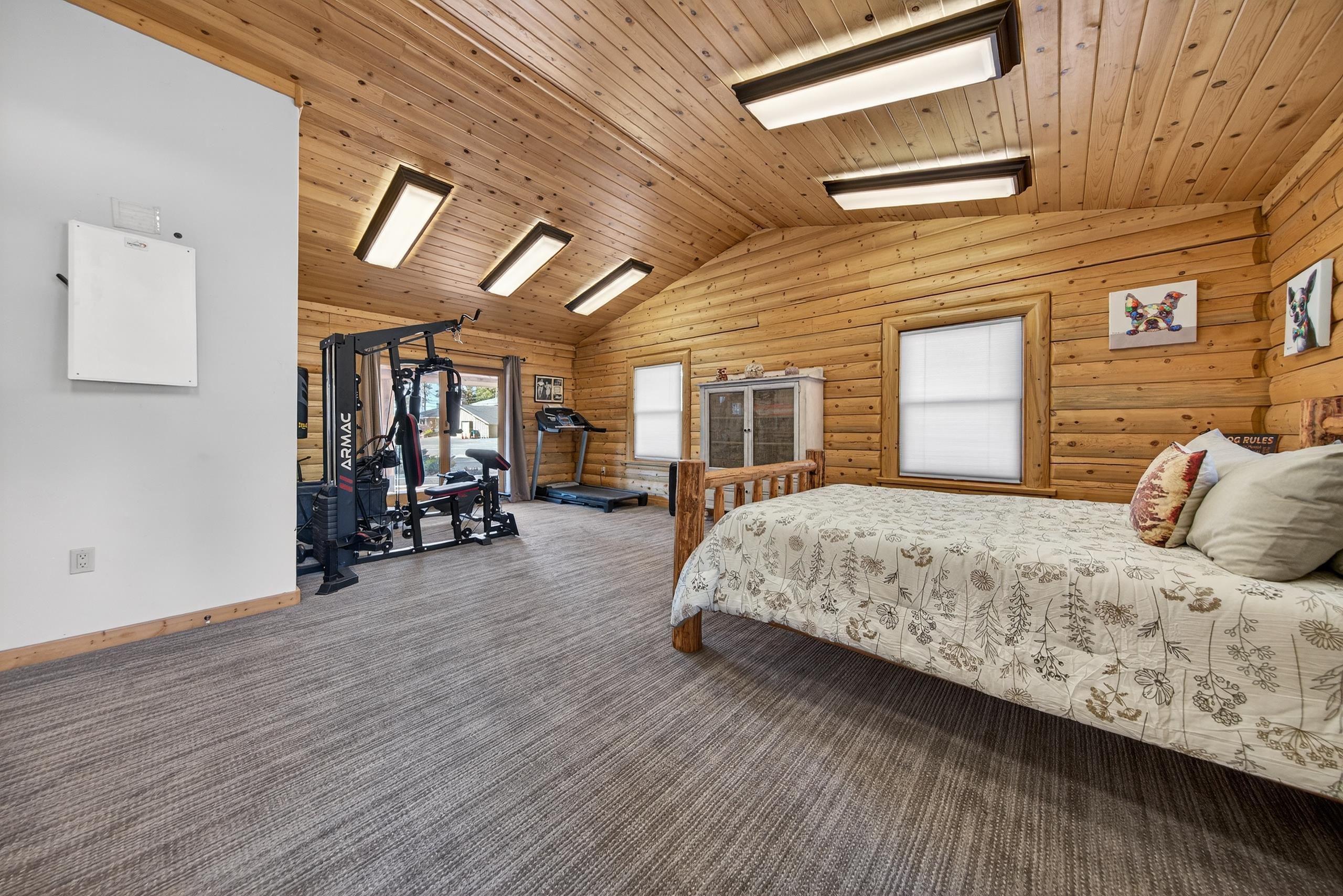 645 Main Street Chester, CA 96020 - Photo 21 of 43 a bedroom with bed and wooden floor