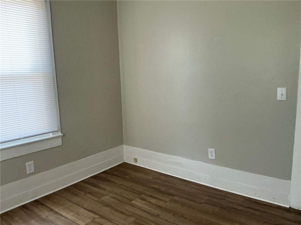 504 Caughlin Avenue Anderson, SC 29624 - Photo 10 of 15 Rich hardwood-style flooring extends throughout this tranquil, sun-drenched room.