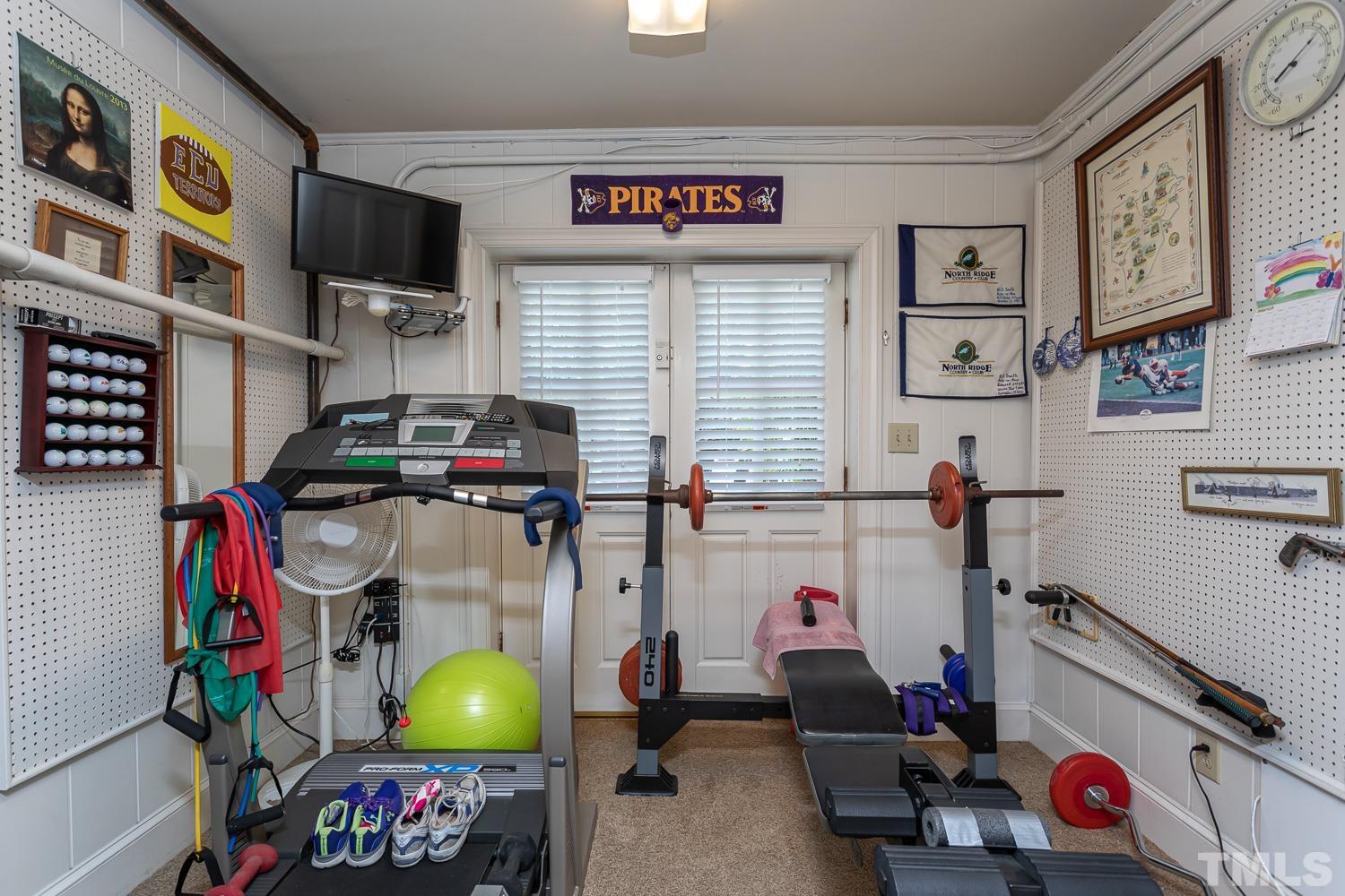 1609 Quaker Ridge Point Raleigh, NC 27615 - Photo 54 of 89 a view of a room with gym equipment