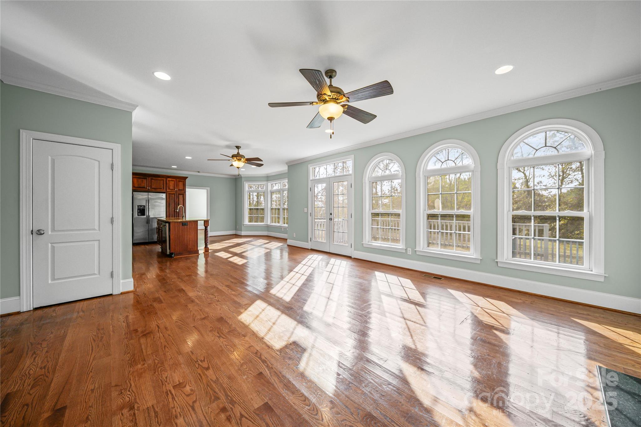 1556 Diggs Road Wadesboro, NC 28170 - Photo 12 of 48 a view of an empty room with wooden floor and a window