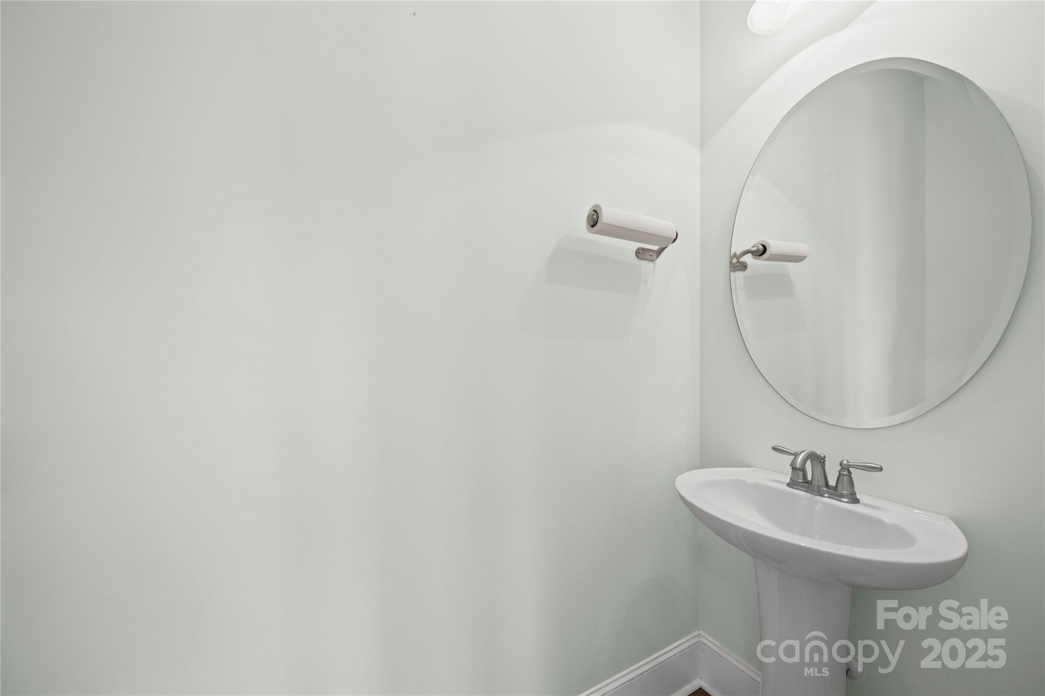 1556 Diggs Road Wadesboro, NC 28170 - Photo 13 of 48 a bathroom with a sink a mirror and vanity