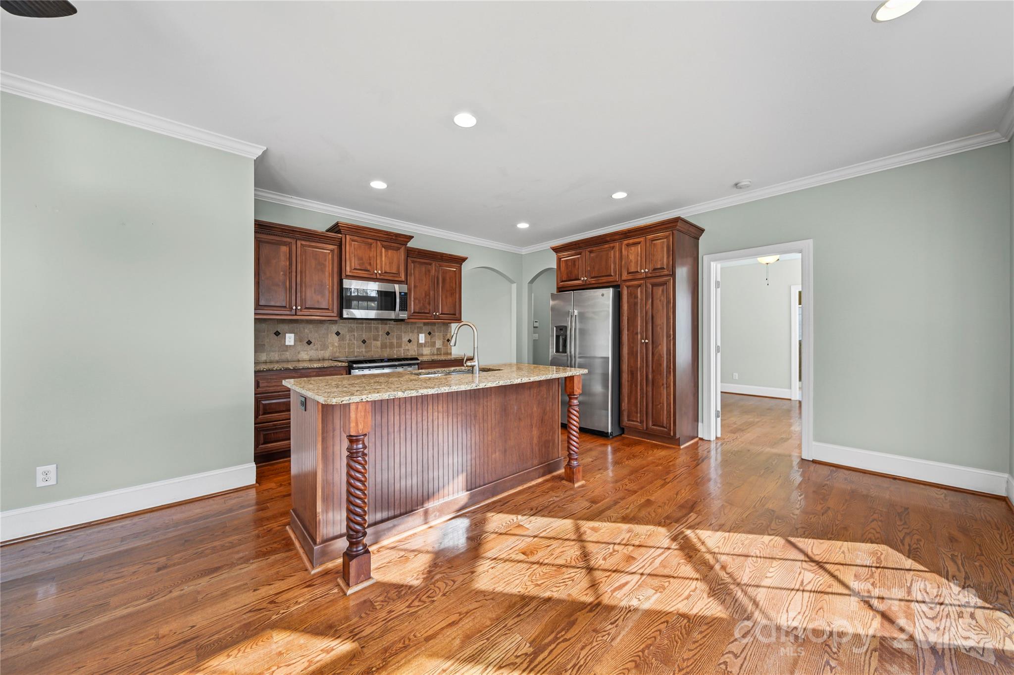 1556 Diggs Road Wadesboro, NC 28170 - Photo 14 of 48 a kitchen with stainless steel appliances granite countertop a refrigerator and a stove top oven