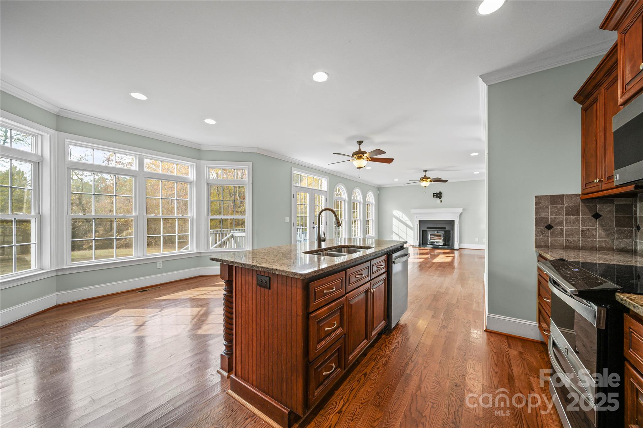 1556 Diggs Road Wadesboro, NC 28170 - Photo 16 of 48 a living room with stainless steel appliances granite countertop a stove and a refrigerator