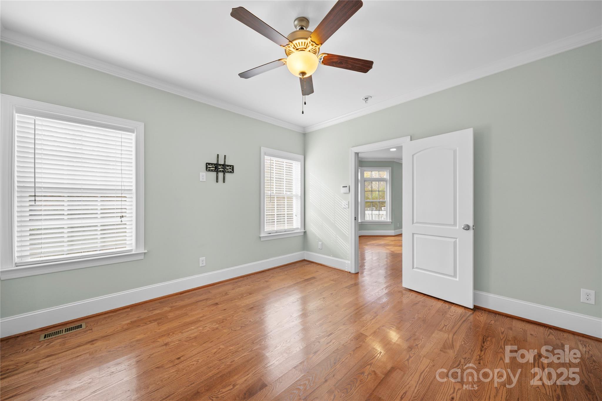 1556 Diggs Road Wadesboro, NC 28170 - Photo 23 of 48 a view of an empty room with window and wooden floor
