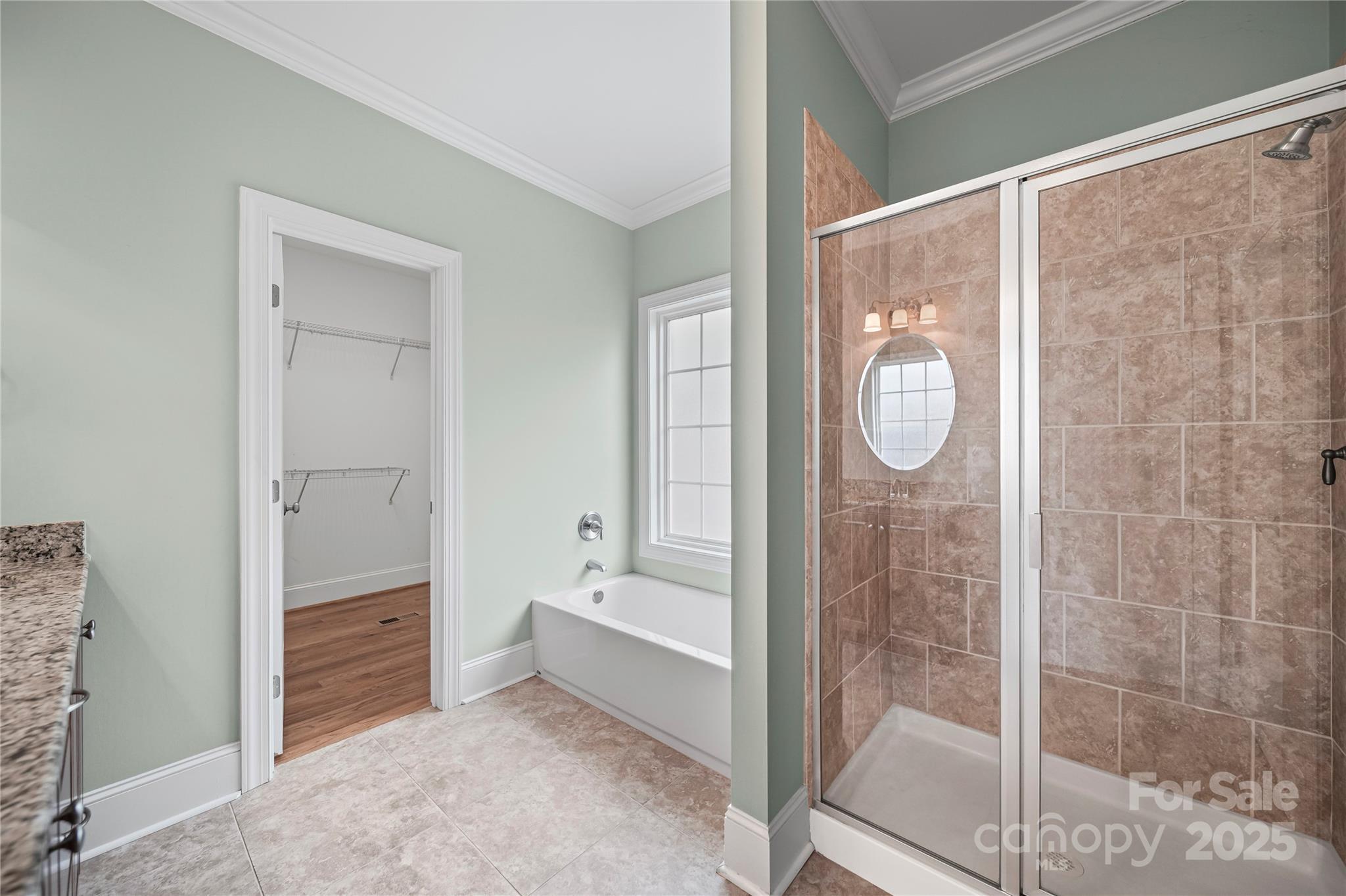 1556 Diggs Road Wadesboro, NC 28170 - Photo 25 of 48 a bathroom with a glass shower door and a sink