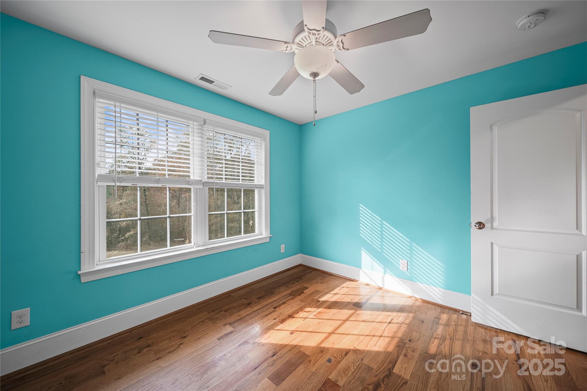 1556 Diggs Road Wadesboro, NC 28170 - Photo 33 of 48 a view of an empty room with wooden floor and a window