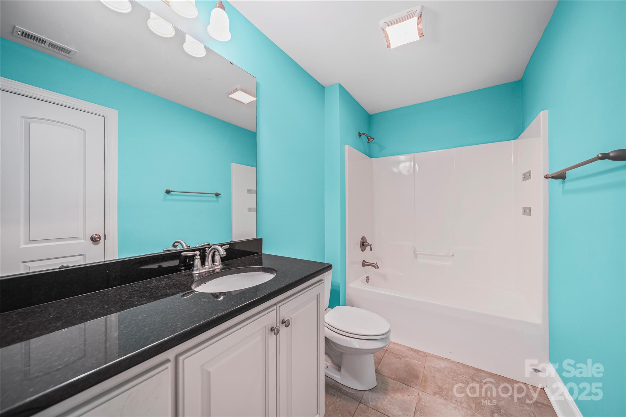 1556 Diggs Road Wadesboro, NC 28170 - Photo 34 of 48 a bathroom with a granite countertop sink toilet and shower