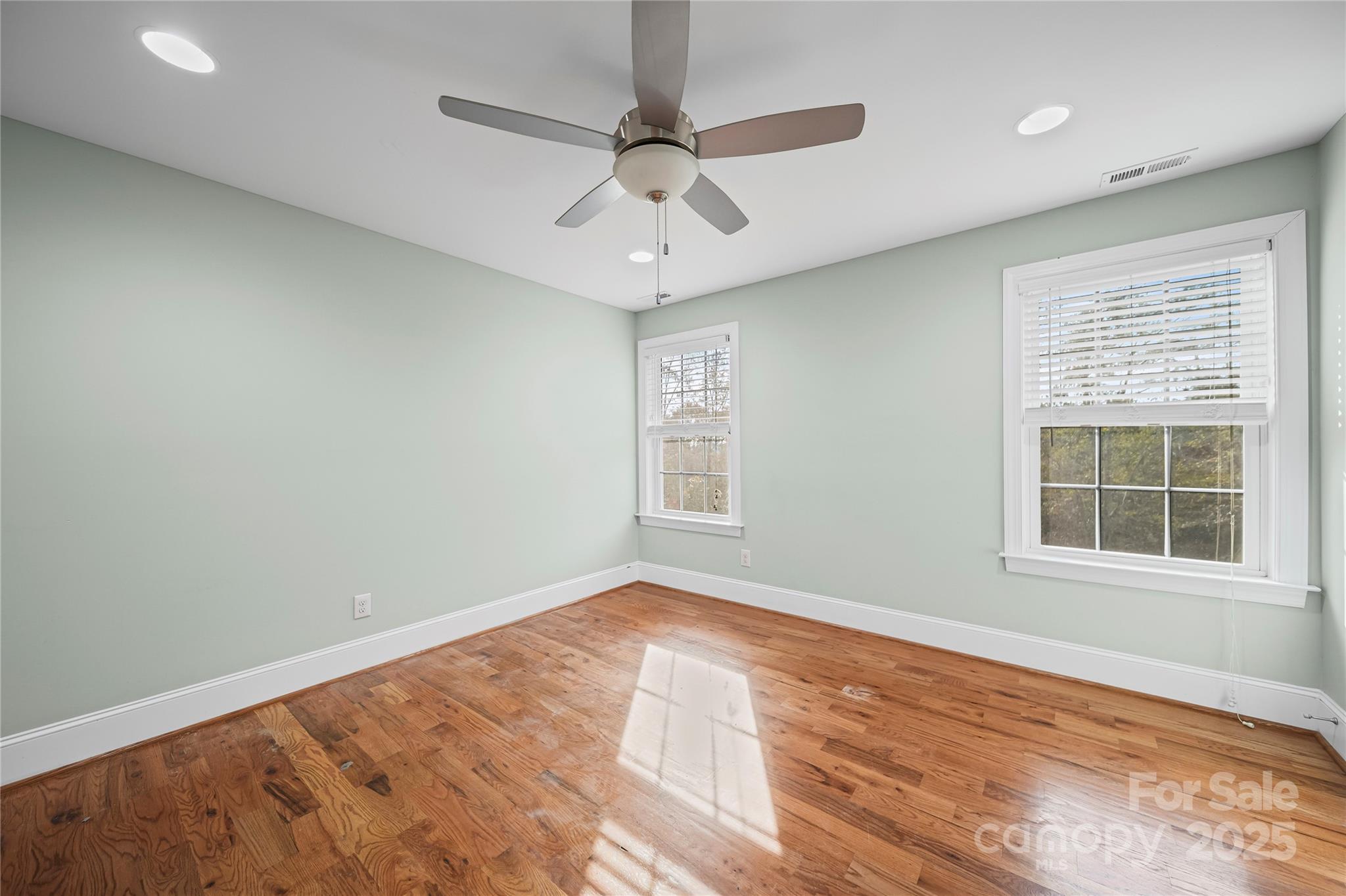 1556 Diggs Road Wadesboro, NC 28170 - Photo 35 of 48 an empty room with a window and a ceiling fan