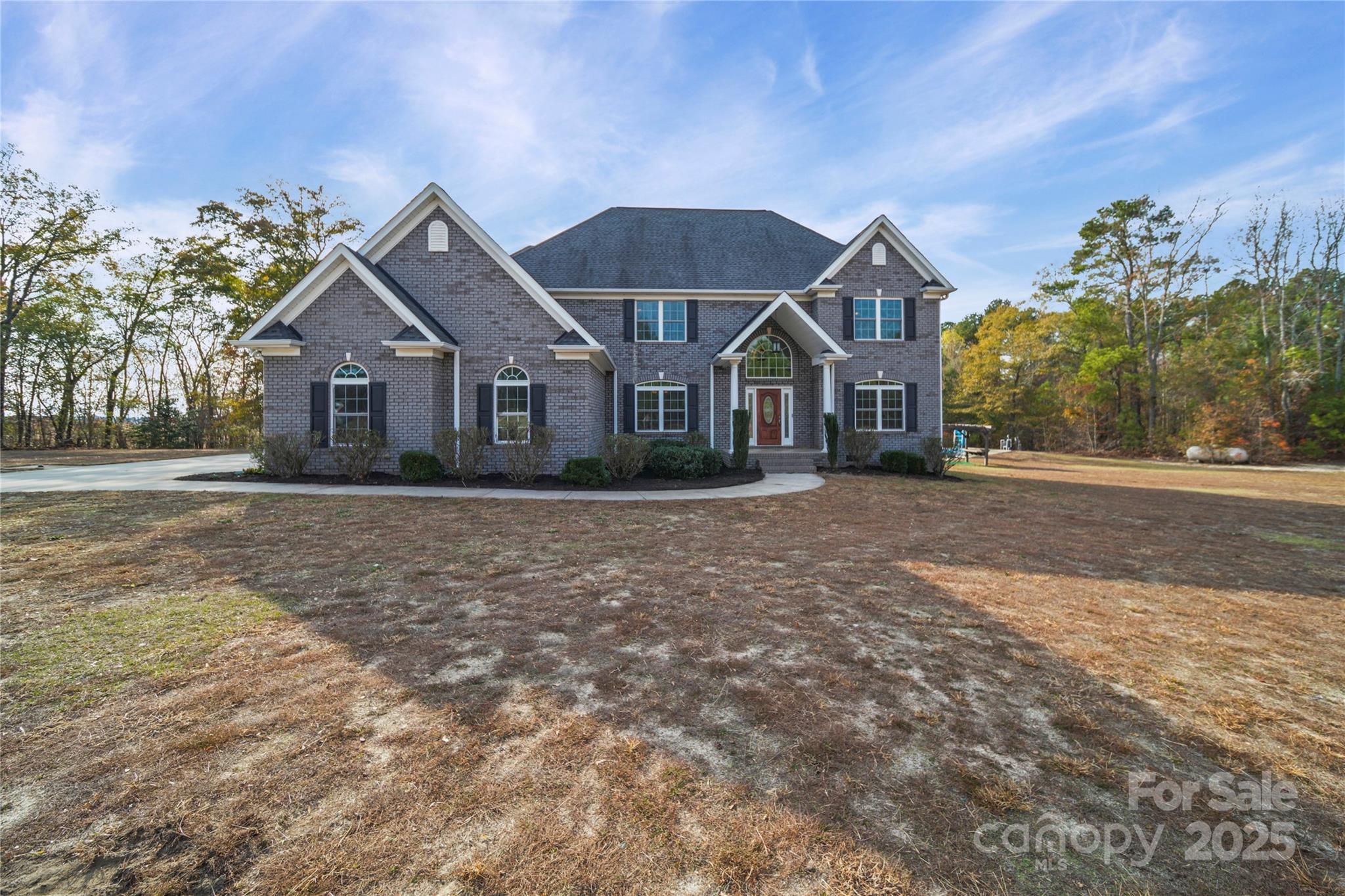 1556 Diggs Road Wadesboro, NC 28170 - Photo 43 of 48 a front view of a house with a garden