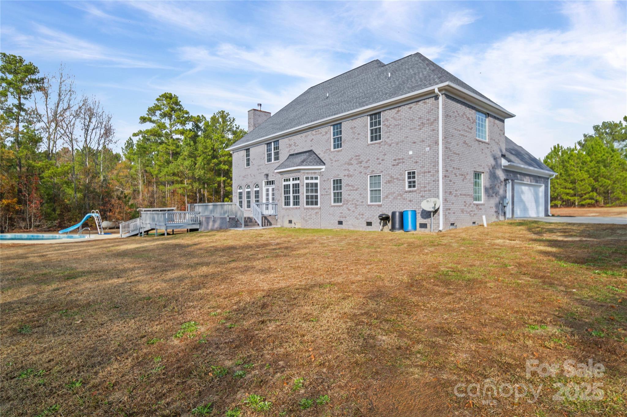 1556 Diggs Road Wadesboro, NC 28170 - Photo 48 of 48 a view of a white house with a yard