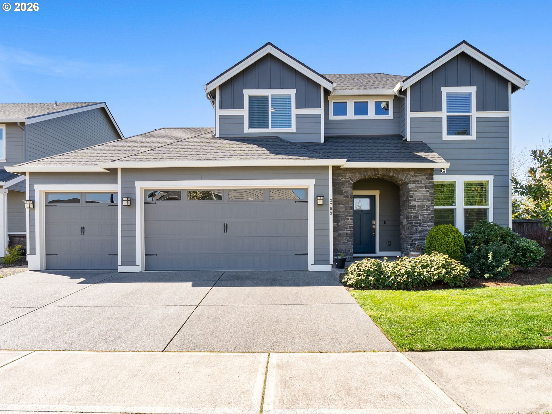 3709 Northeast Pioneer Street Camas, WA 98607 - Photo 1 of 30 a front view of a house with a yard and garage