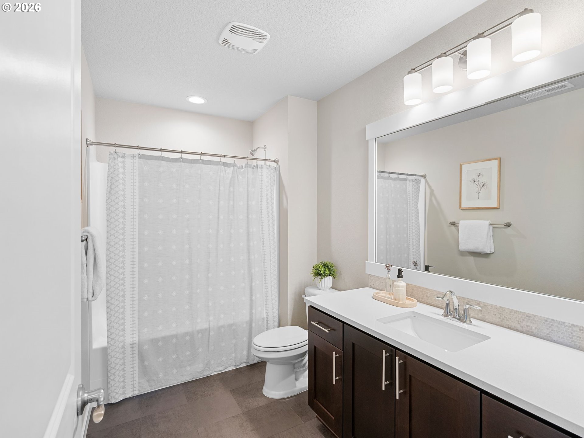 3709 Northeast Pioneer Street Camas, WA 98607 - Photo 24 of 30 a bathroom with a granite countertop sink toilet and shower