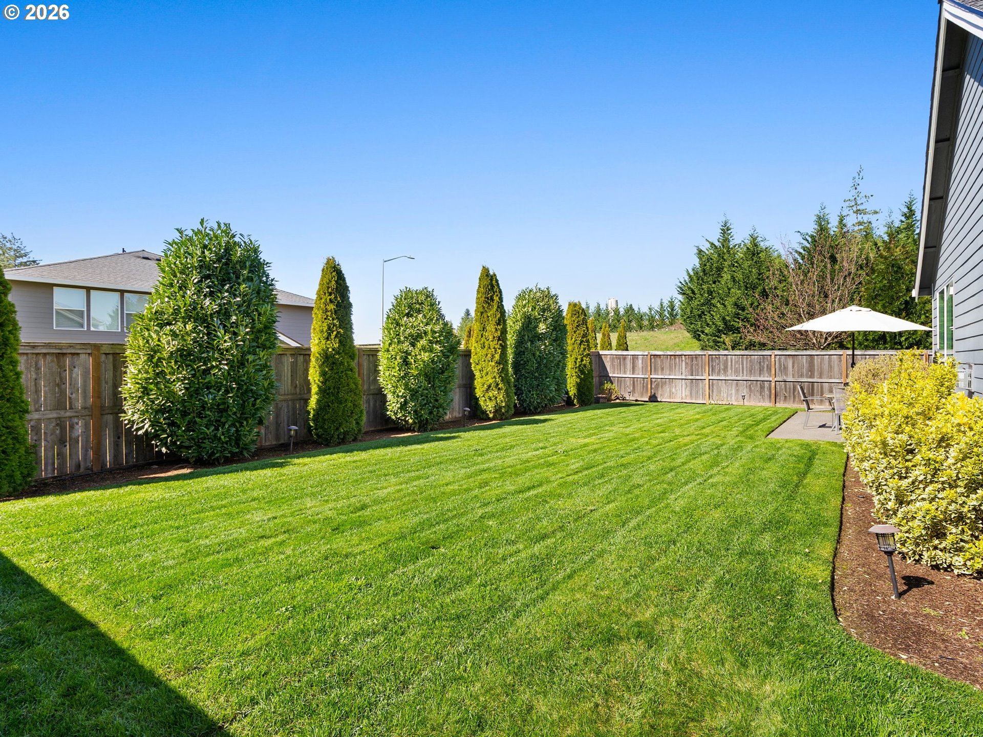 3709 Northeast Pioneer Street Camas, WA 98607 - Photo 27 of 30 a view of a garden with a building in the background