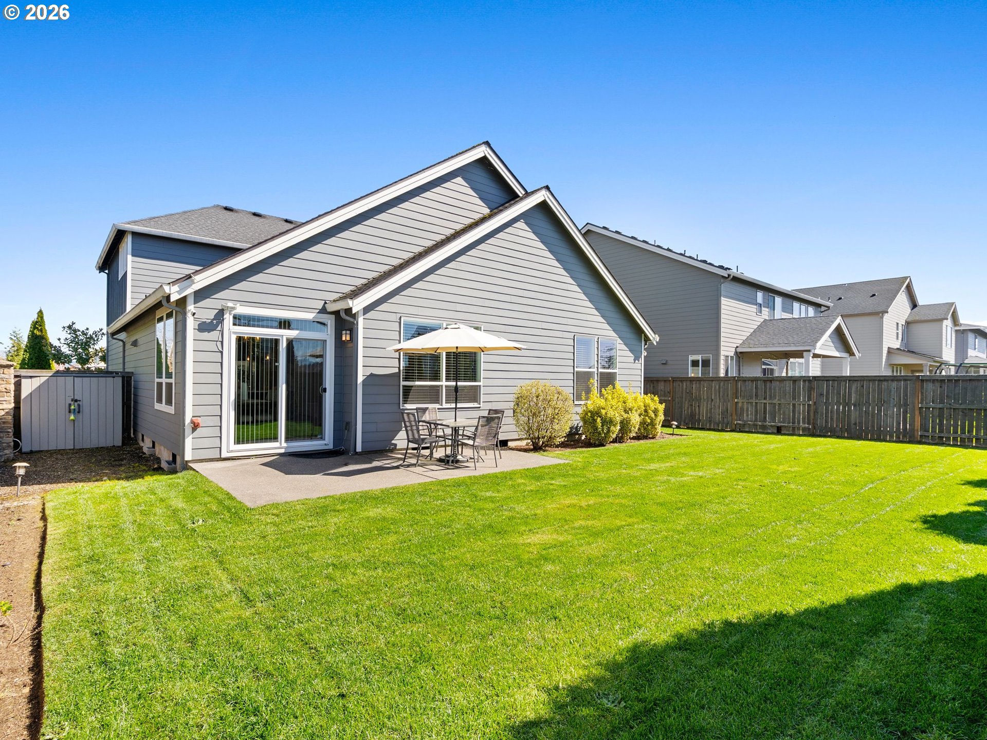 3709 Northeast Pioneer Street Camas, WA 98607 - Photo 28 of 30 a view of a house with a patio and a yard