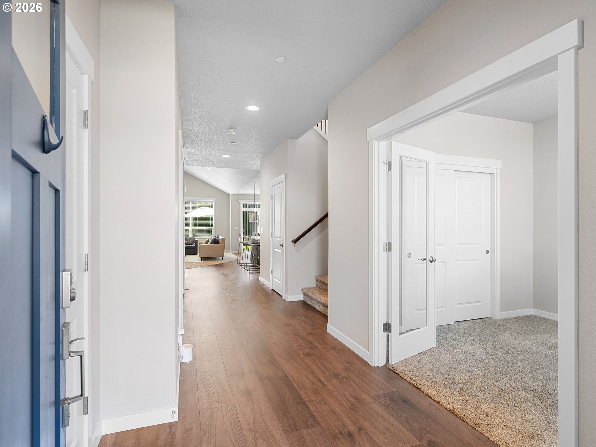 3709 Northeast Pioneer Street Camas, WA 98607 - Photo 3 of 30 a view of a hallway with wooden floor and staircase