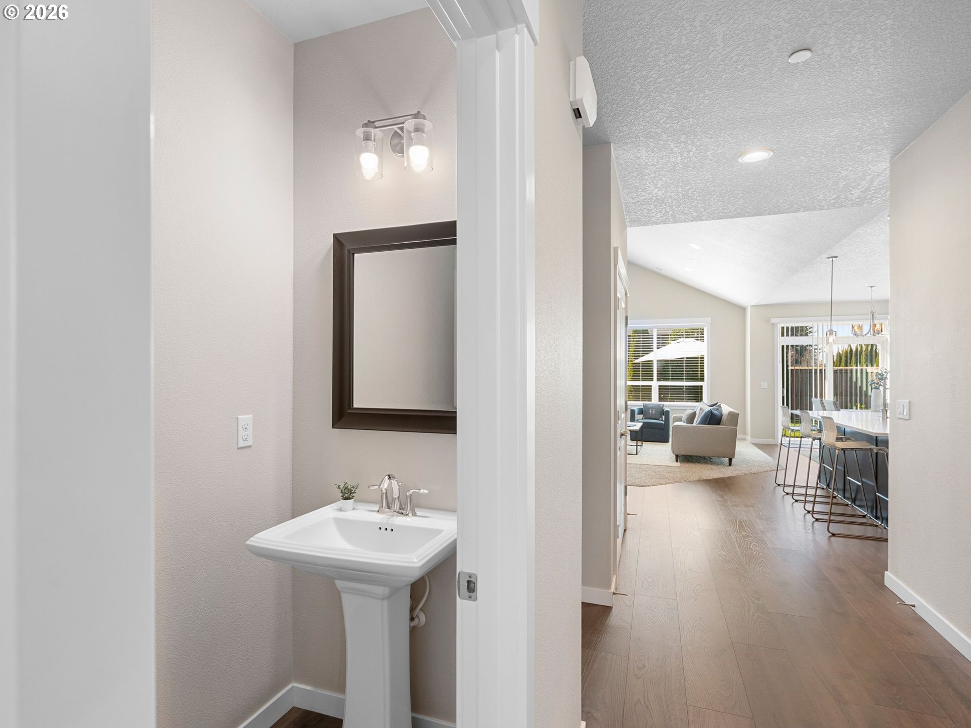 3709 Northeast Pioneer Street Camas, WA 98607 - Photo 5 of 30 a bathroom with a sink a mirror and wooden floors