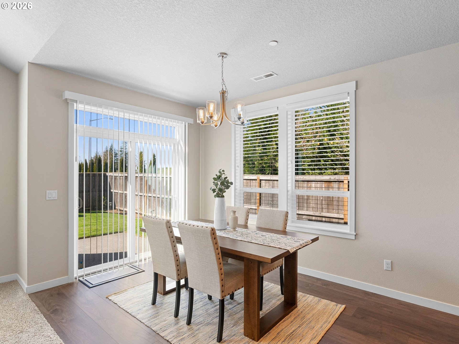 3709 Northeast Pioneer Street Camas, WA 98607 - Photo 10 of 30 a view of a dining room with furniture window and wooden floor