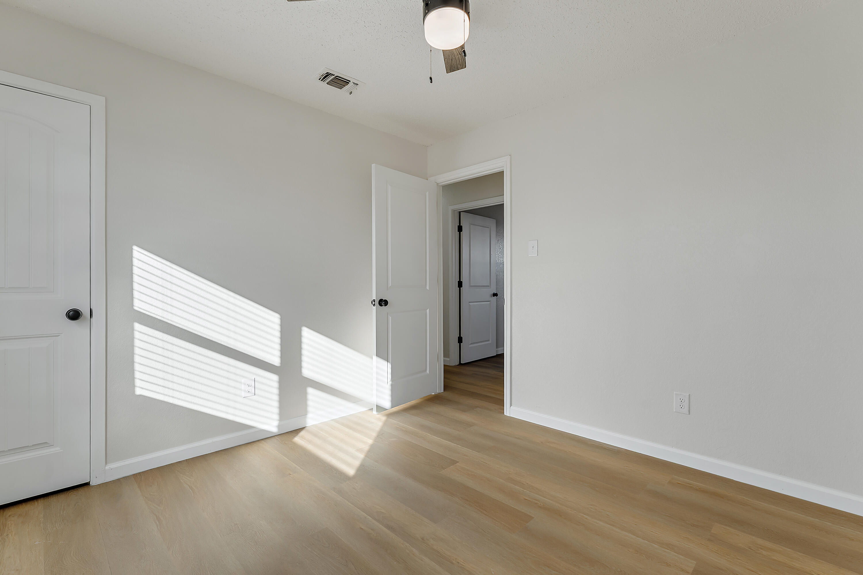 726 11th Street Wolfforth, TX 79382 - Photo 16 of 22 a view of an empty room with wooden floor