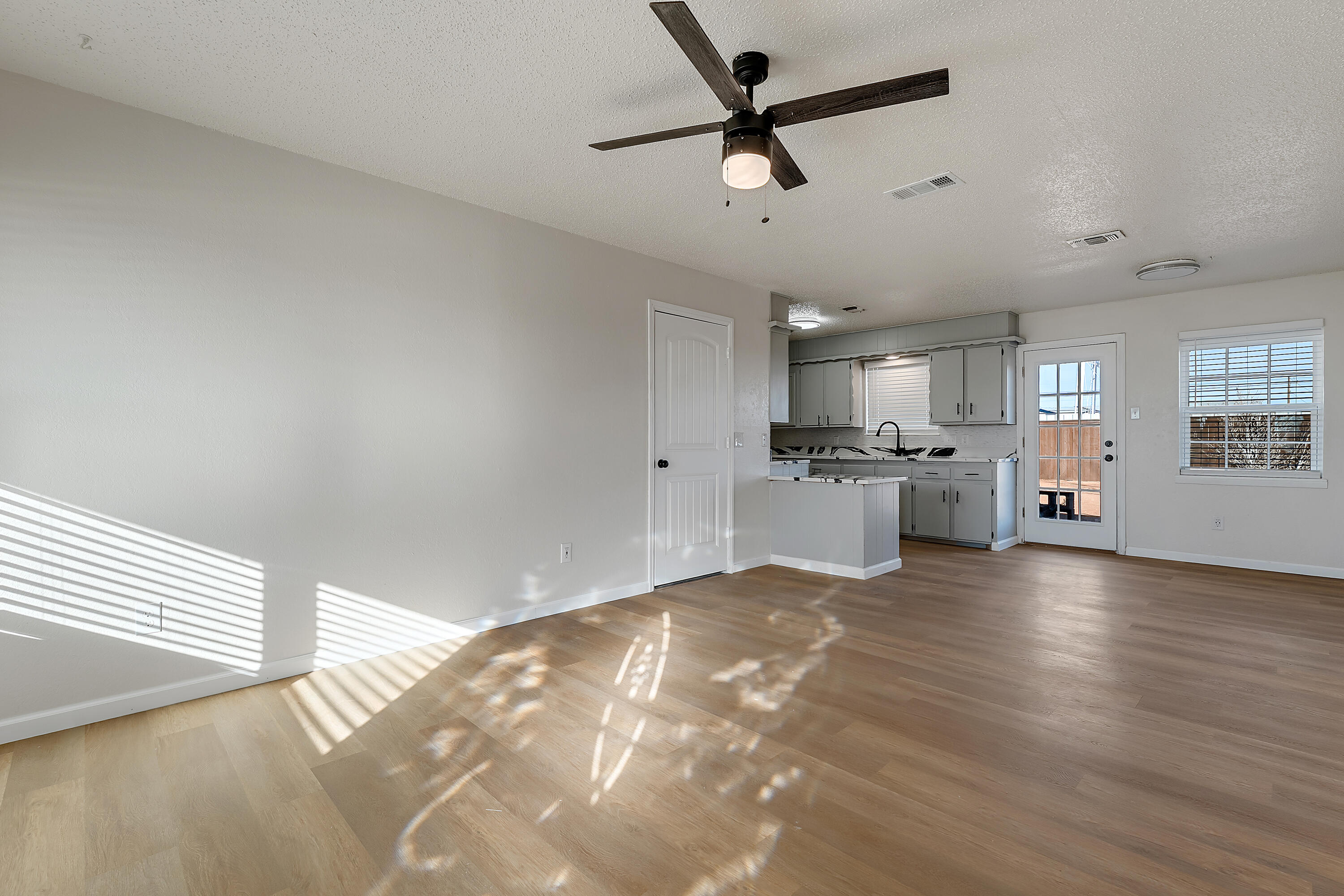 726 11th Street Wolfforth, TX 79382 - Photo 3 of 22 a view of a kitchen with a sink and a window