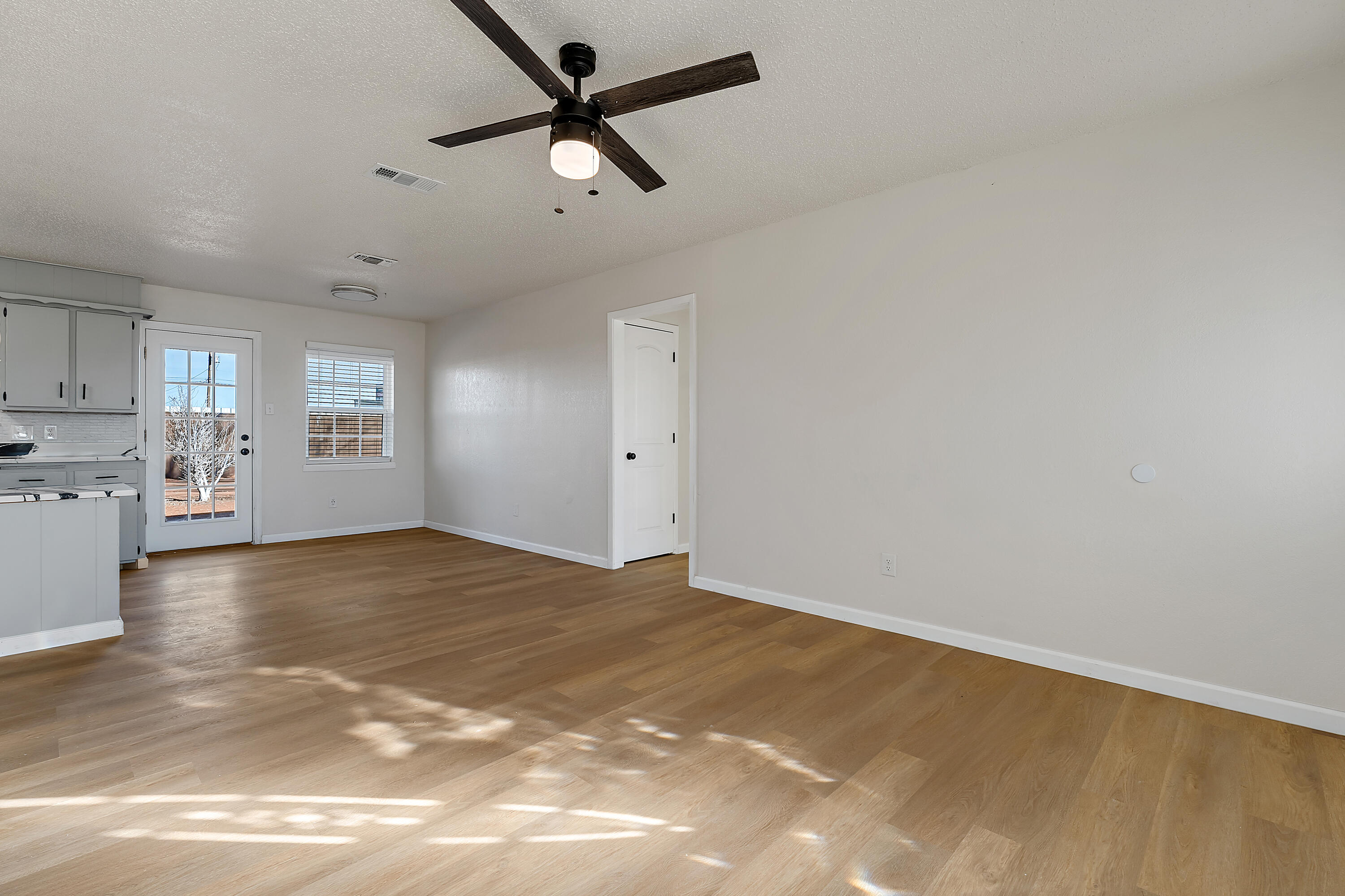 726 11th Street Wolfforth, TX 79382 - Photo 4 of 22 a view of a kitchen with a sink and cabinets
