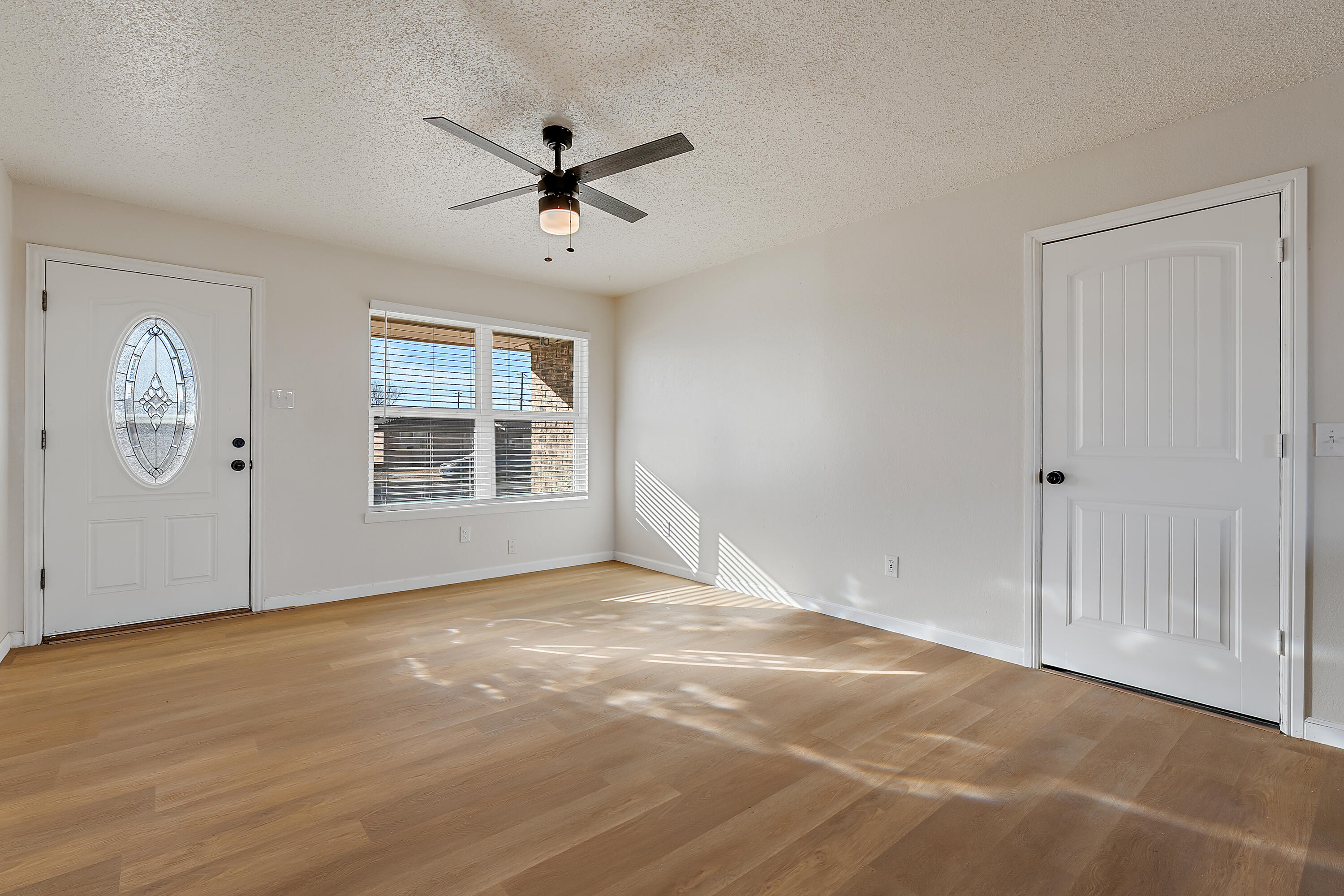 726 11th Street Wolfforth, TX 79382 - Photo 6 of 22 a view of an empty room with a window