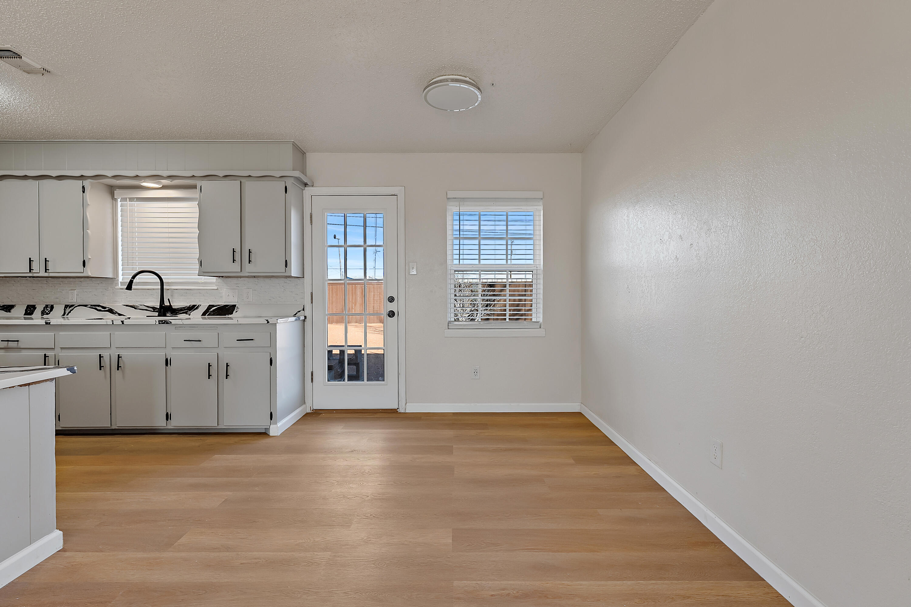 726 11th Street Wolfforth, TX 79382 - Photo 7 of 22 a view of a kitchen with white cabinets