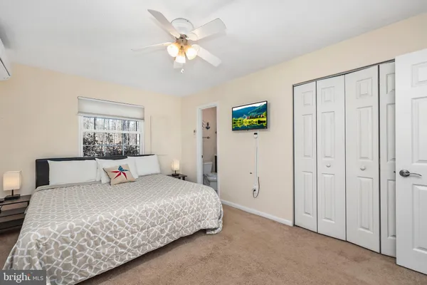 a white toilet sitting next to a bathroom sink