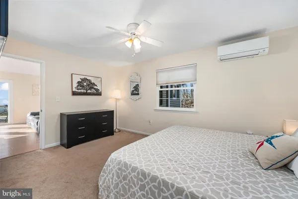 a view of a living room with furniture and stairs