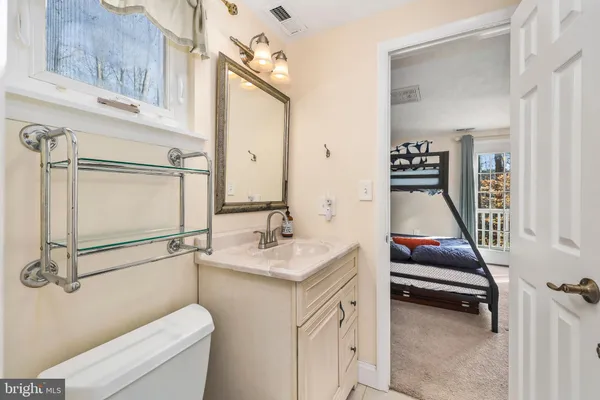 a bedroom with double bunk beds and a window