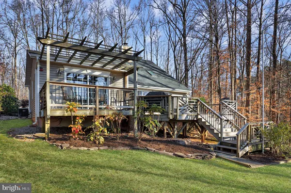 a view of a backyard with sitting area