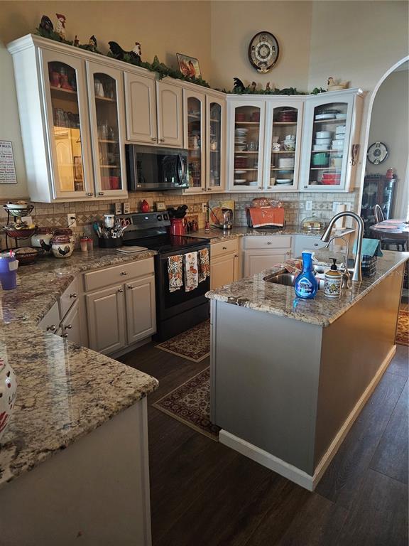 116 Raintree Court Auburndale, FL 33823 - Photo 17 of 45 a kitchen with stainless steel appliances granite countertop a stove and a sink