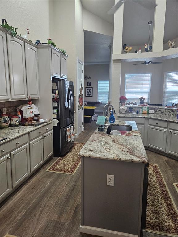 116 Raintree Court Auburndale, FL 33823 - Photo 18 of 45 a kitchen with stainless steel appliances granite countertop a sink stove and refrigerator