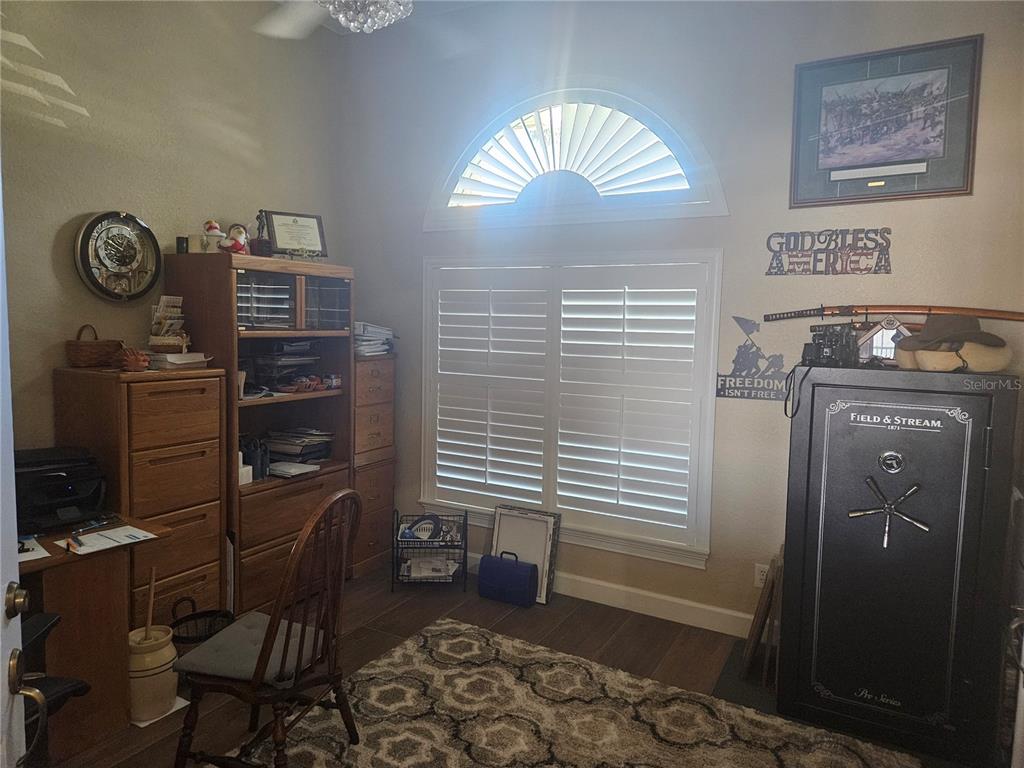 116 Raintree Court Auburndale, FL 33823 - Photo 22 of 45 a view of a storage & utility room with racks on the wall