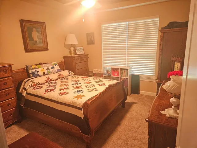 a dining room with furniture and a floor to ceiling window