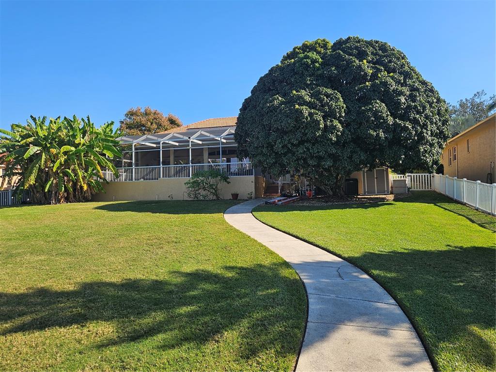 116 Raintree Court Auburndale, FL 33823 - Photo 30 of 45 a view of a house with a swimming pool