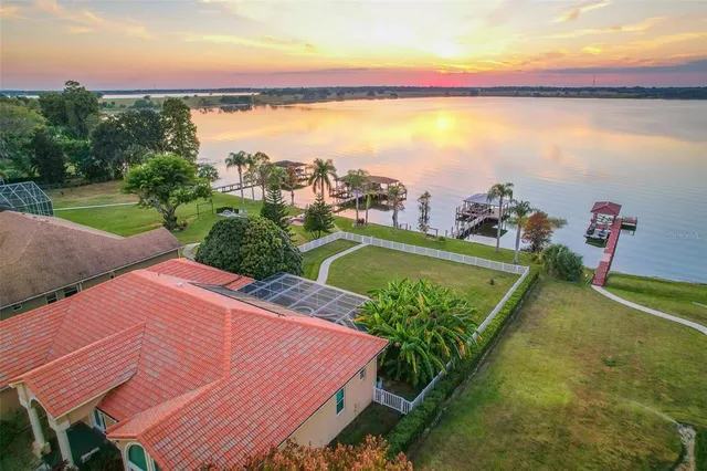 a view of swimming pool with outdoor seating space and mountain view in back