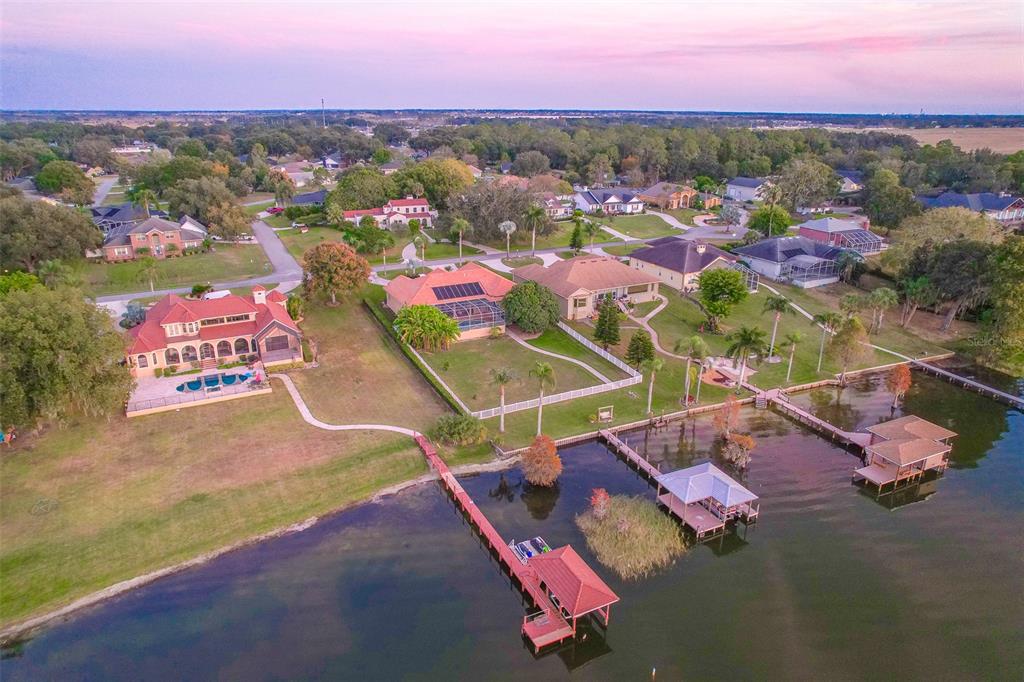 116 Raintree Court Auburndale, FL 33823 - Photo 8 of 45 an aerial view of a city with lots of residential buildings ocean and mountain view in back