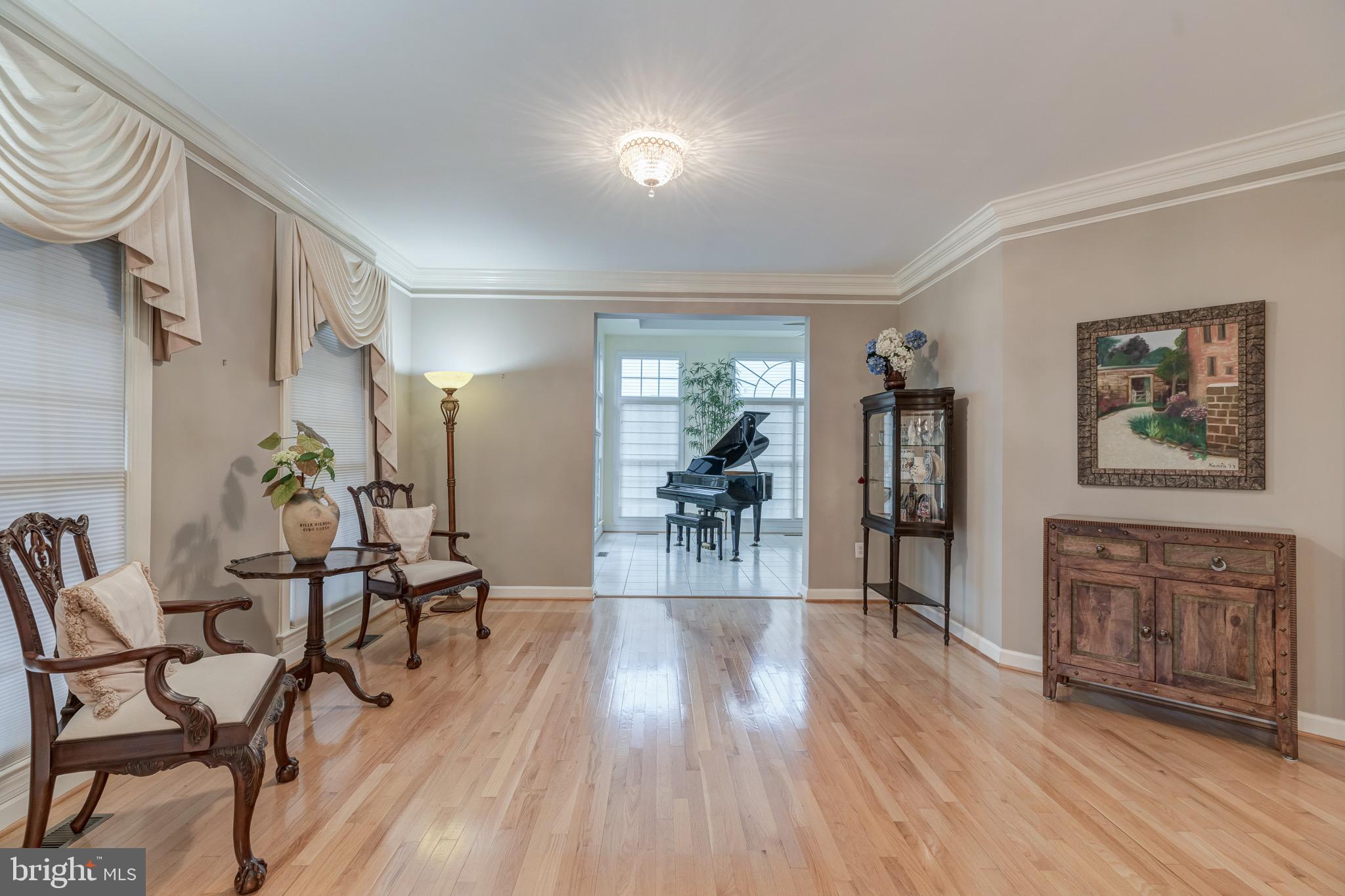 7424 Spring Summit Road Springfield, VA 22150 - Photo 3 of 51 Elegant living room leading to sunroom