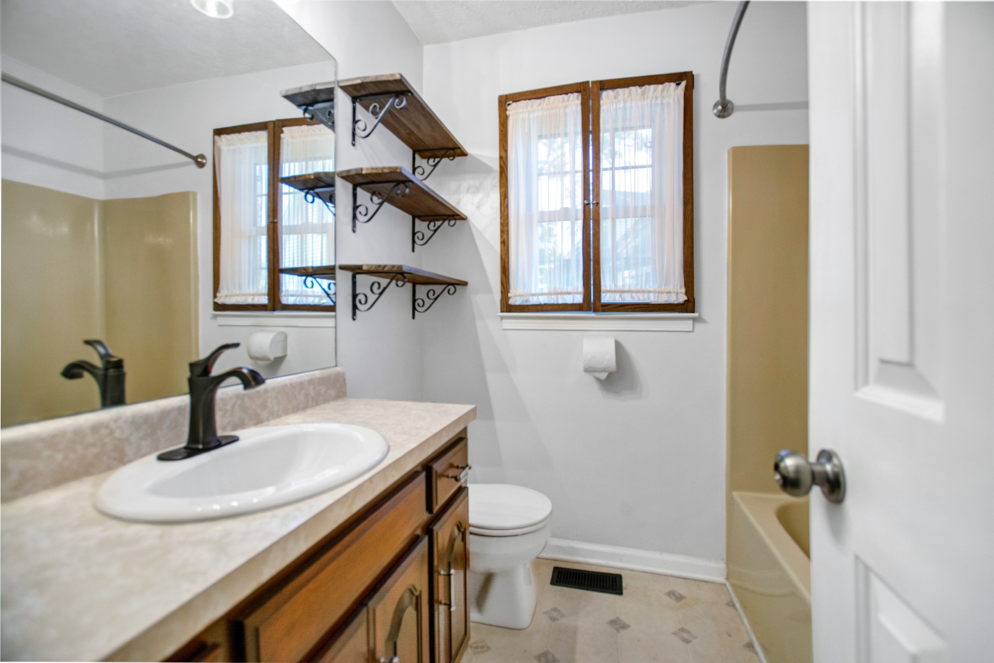 128 South Richview Road Clarksville, TN 37043 - Photo 10 of 19 a bathroom with a sink toilet and shower