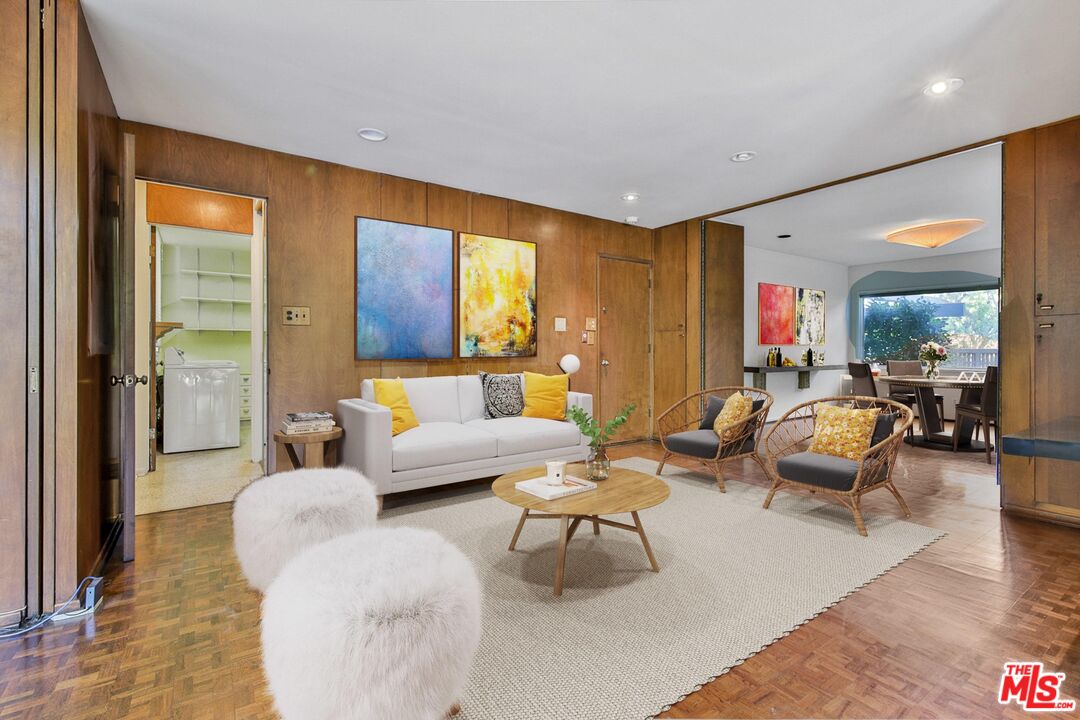 1749 Mandeville Lane Los Angeles, CA 90049 - Photo 11 of 38 a living room with furniture and large windows