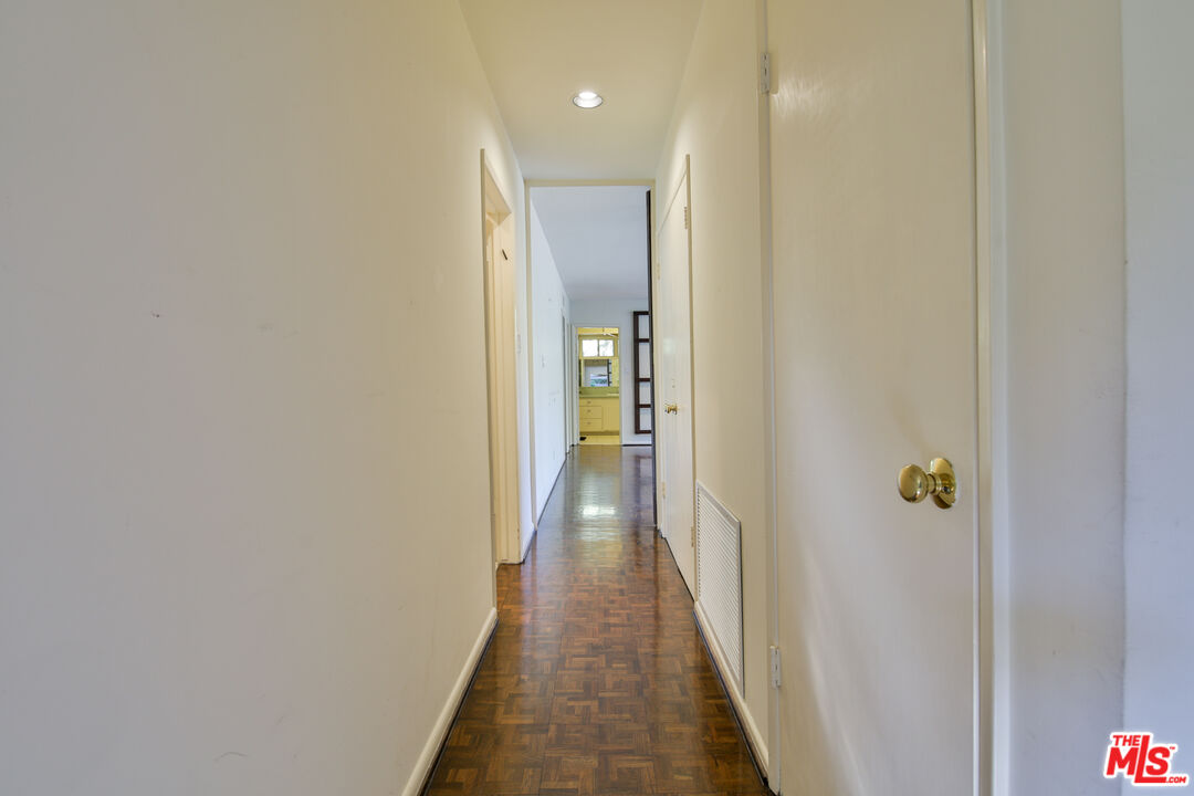 1749 Mandeville Lane Los Angeles, CA 90049 - Photo 16 of 38 a view of a hallway with wooden floor