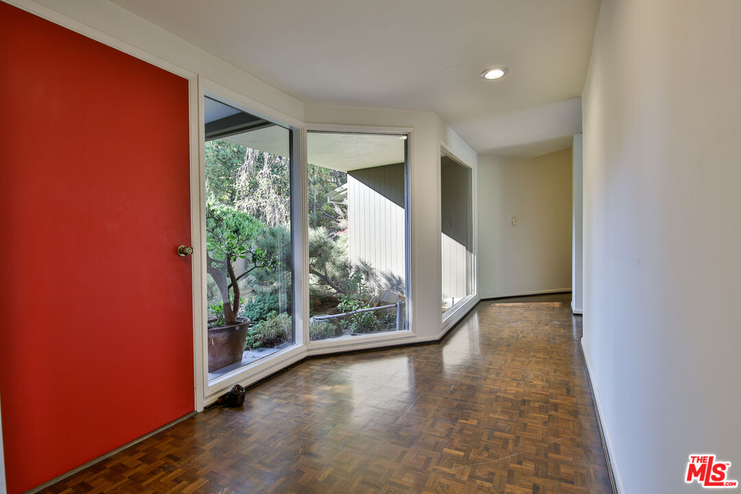 1749 Mandeville Lane Los Angeles, CA 90049 - Photo 3 of 38 wooden floor in an empty room with a window