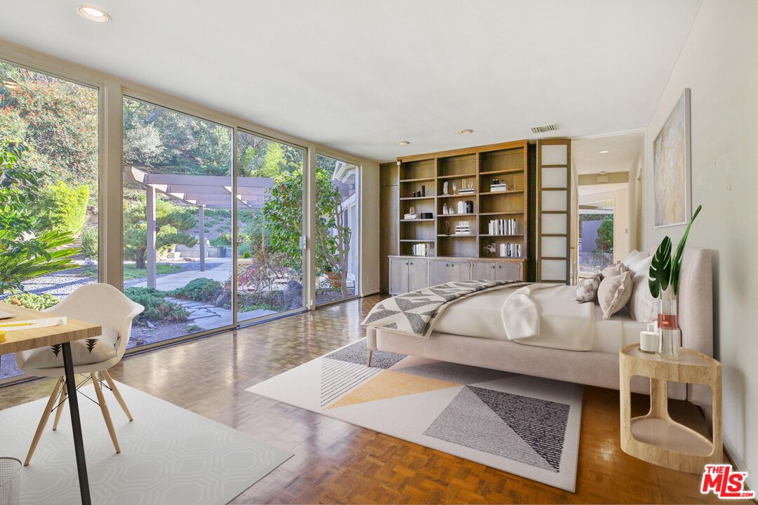 1749 Mandeville Lane Los Angeles, CA 90049 - Photo 21 of 38 a living room with furniture and large windows