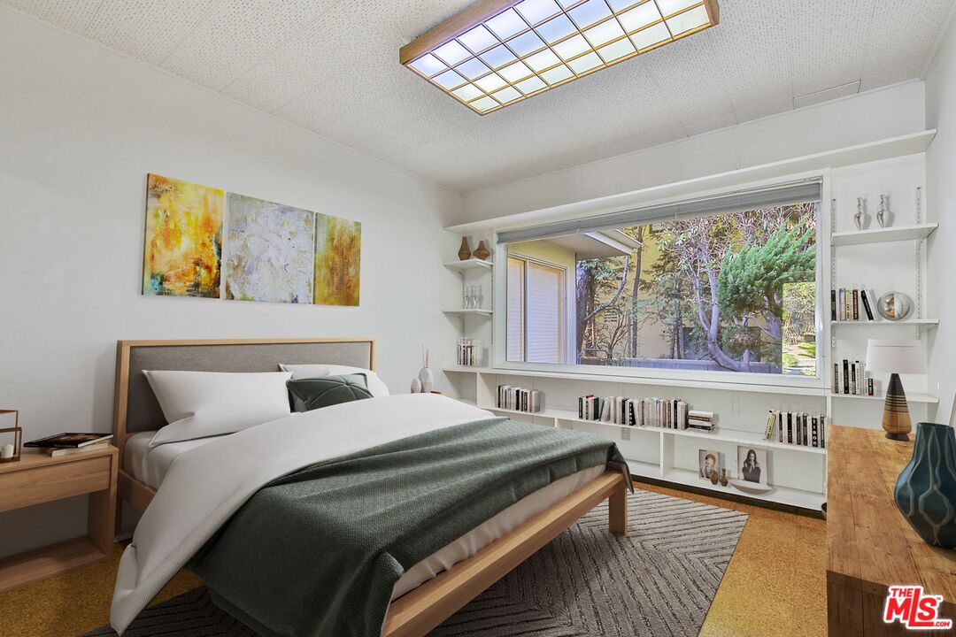 1749 Mandeville Lane Los Angeles, CA 90049 - Photo 22 of 38 a bedroom with a bed and a large window with the outer view