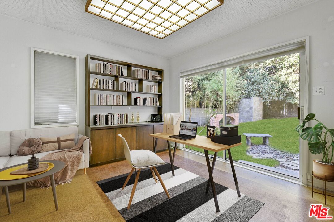 1749 Mandeville Lane Los Angeles, CA 90049 - Photo 23 of 38 a living room with furniture and a potted plant