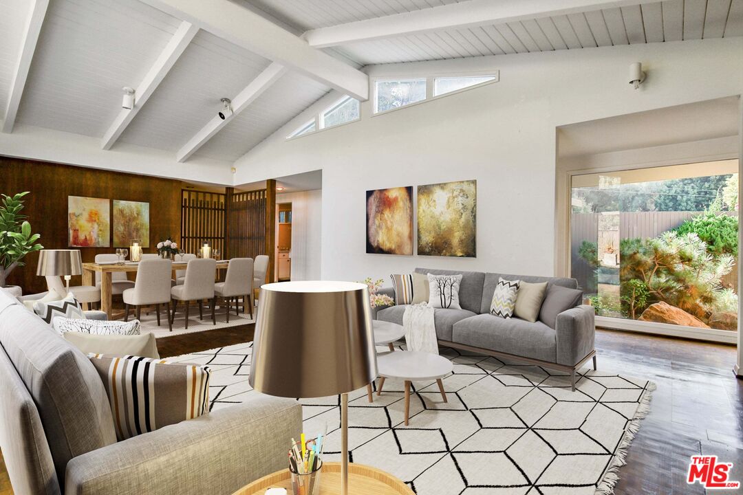 1749 Mandeville Lane Los Angeles, CA 90049 - Photo 4 of 38 a living room with furniture and a flat screen tv