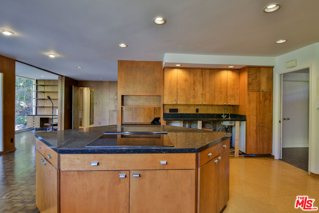 1749 Mandeville Lane Los Angeles, CA 90049 - Photo 8 of 38 a kitchen with stainless steel appliances granite countertop a sink a stove and a refrigerator
