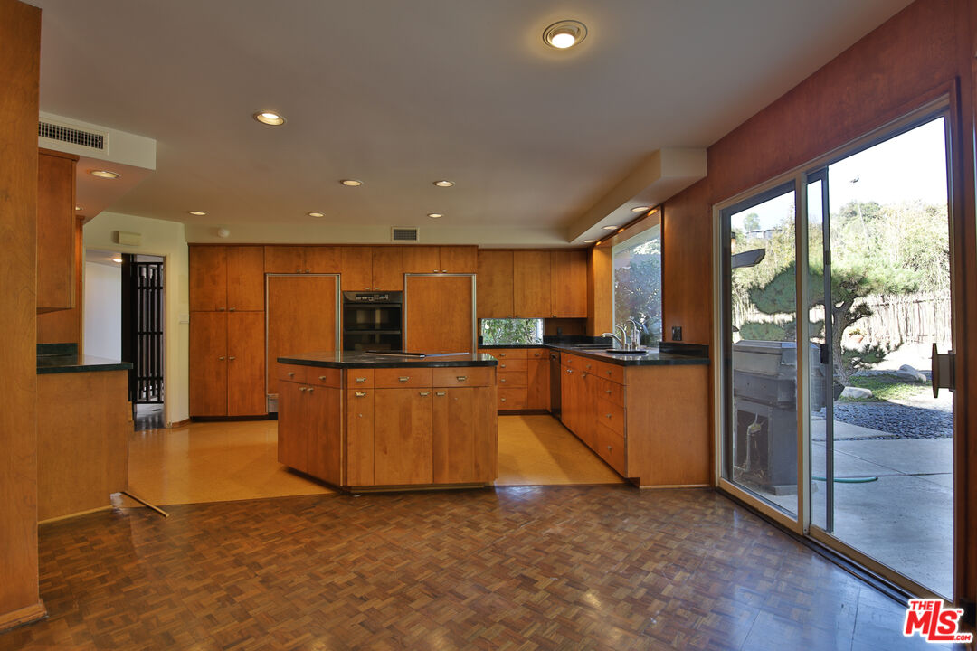 1749 Mandeville Lane Los Angeles, CA 90049 - Photo 9 of 38 a view of kitchen with furniture and refrigerator